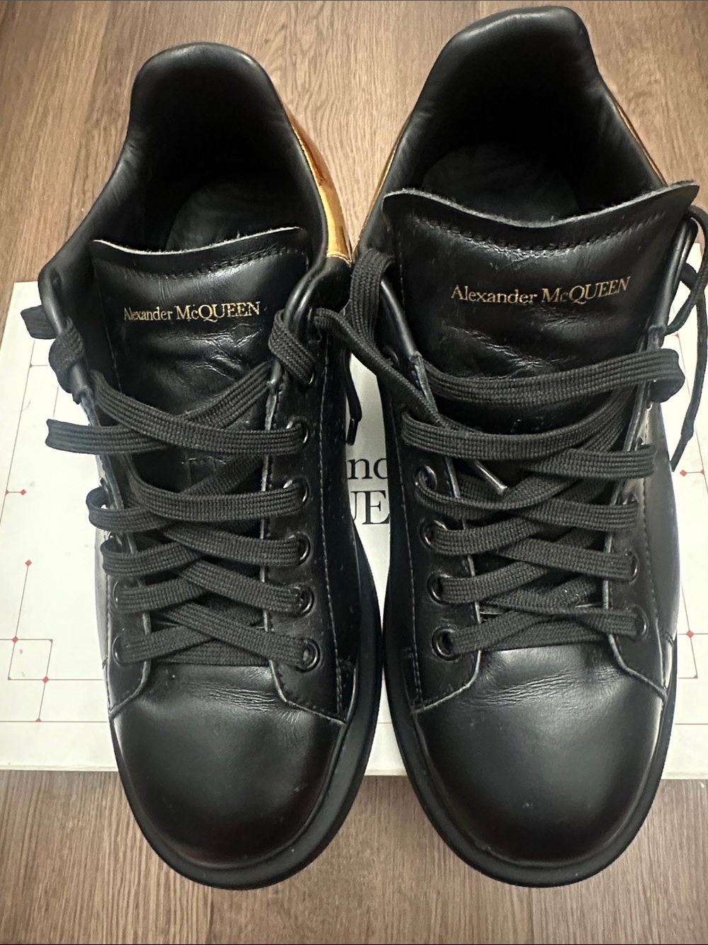 Alexander McQueen Black Leather Sneakers with Metallic Gold Heel